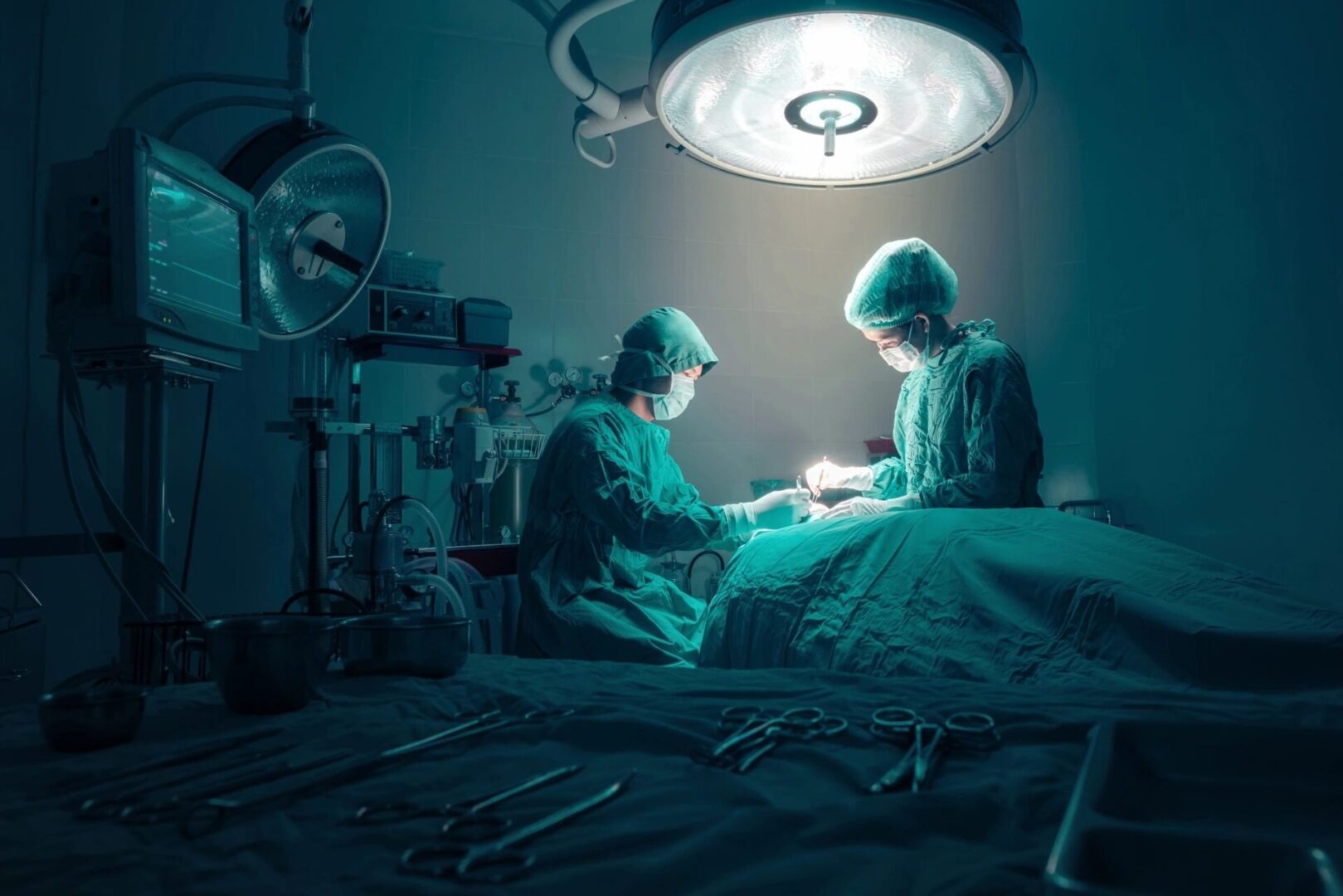 Two surgeons in a room with lights on